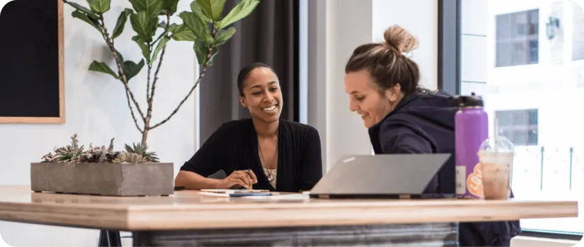 two women collaborating together
