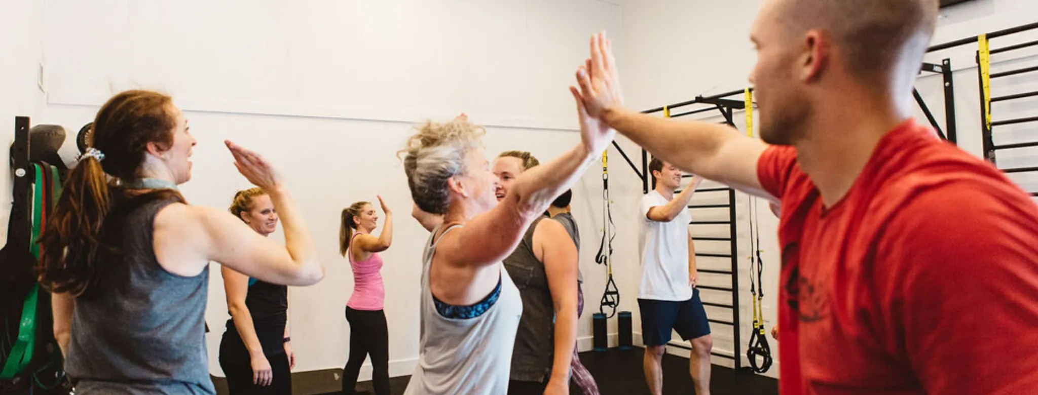 Clients give high-fives at McAlister Training