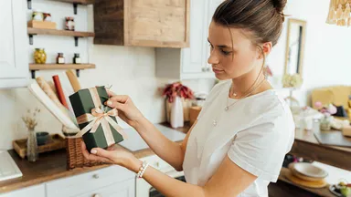 business owner preparing for the holidays and wrapping gifts